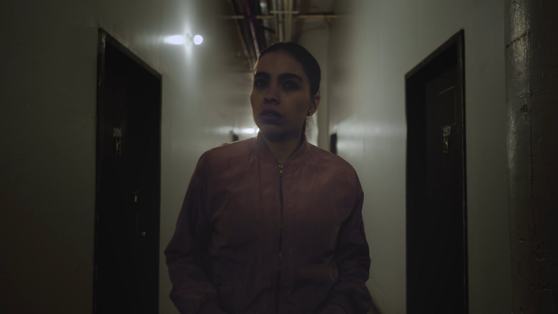 A Letter film still — walking down a hallway