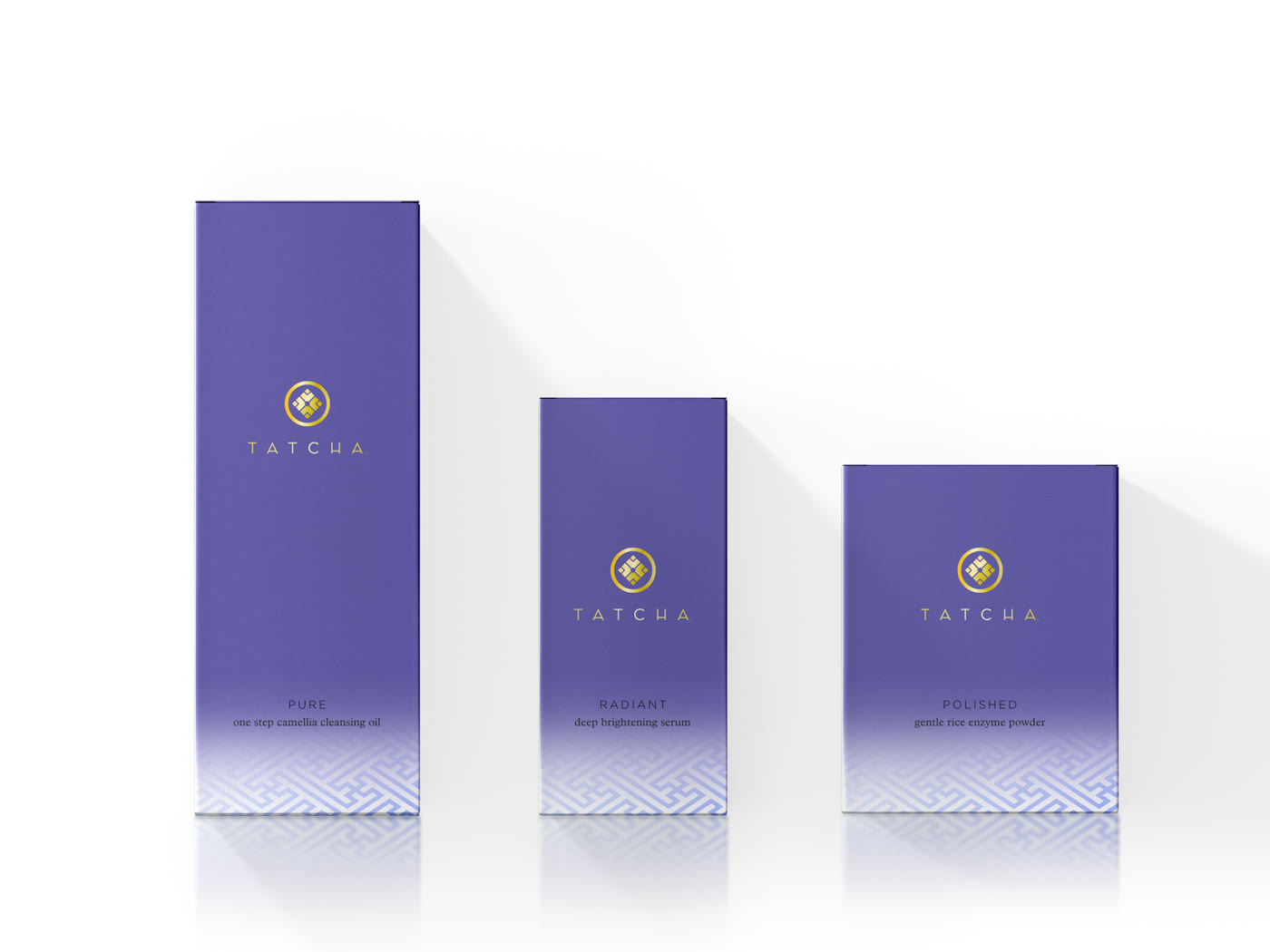 Tatcha packaging boxes in tiered sizes on a purple gradient